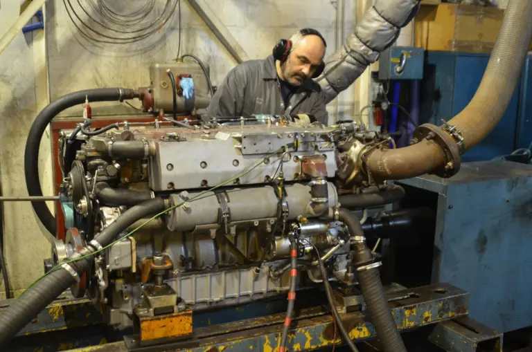 An overhauled engine is given a test run in the Royston workshop