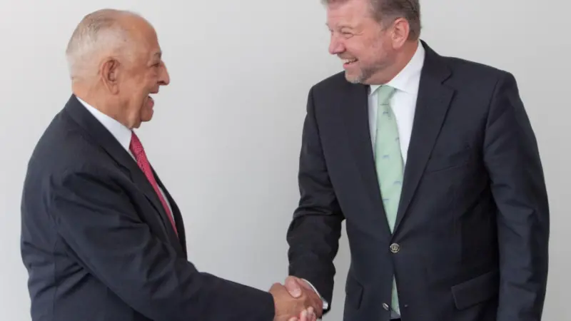 Dr Hermann J. Klein, IACS chairman (right), is obviously very happy to welcome IRS and its chairman, Captain J.C. Anand, to IACS.