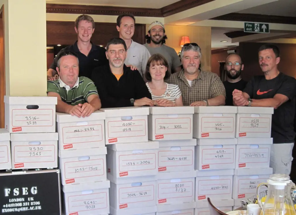 Members of the university research team with some of the data collected from the trials