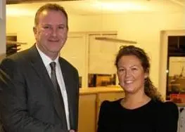 Andrew Stephens congratulating Thea Corwin on her appointment.
