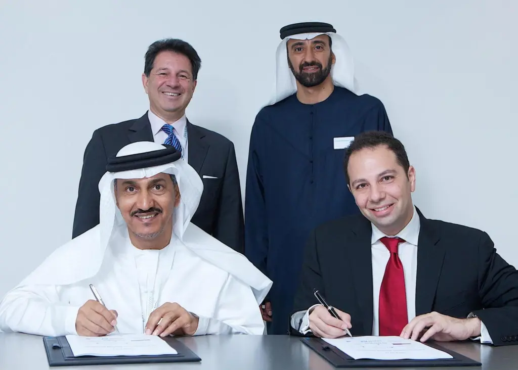 Signing to MoU: back row (left to right): Tarek Ragheb, chairman De Birs, Homaid Al Shemmari, chairman, ADSB; front row (left to right): Mohamed Salem Al Junaibi, CEO, ADSB & Rady W. Fahmy, senior director and board member, DeBirs