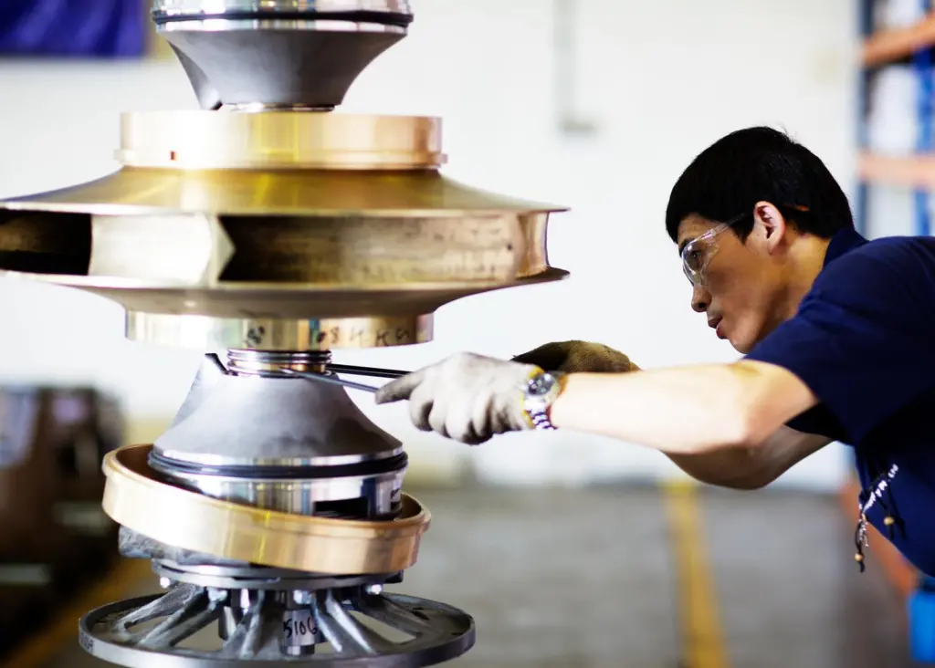 Working on a cargo pump at Hamworthy's Far Eastern facility