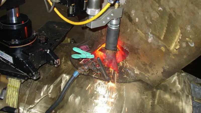 Seized variable pitched propeller blade stud being removed to enable replacement of seals