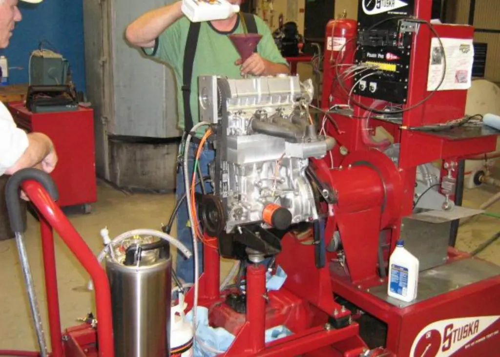 A small Suzuki engine has been converted to detonate vaporised / gaseous fuels, by elongating the cylinder to hold a harmonic oscillator which sets explosions; fuel supply was limited to prevent bursting but 40% higher power output was still ach...