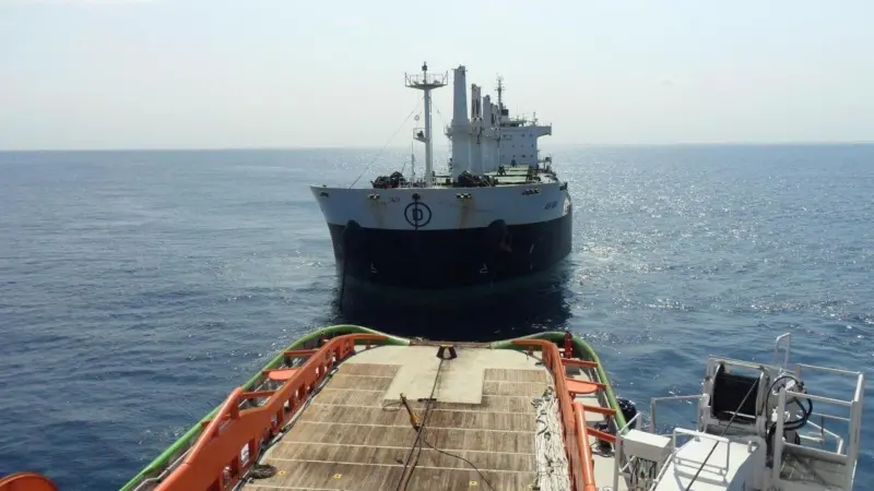 The Akiba being towed by Fairmount Glacier