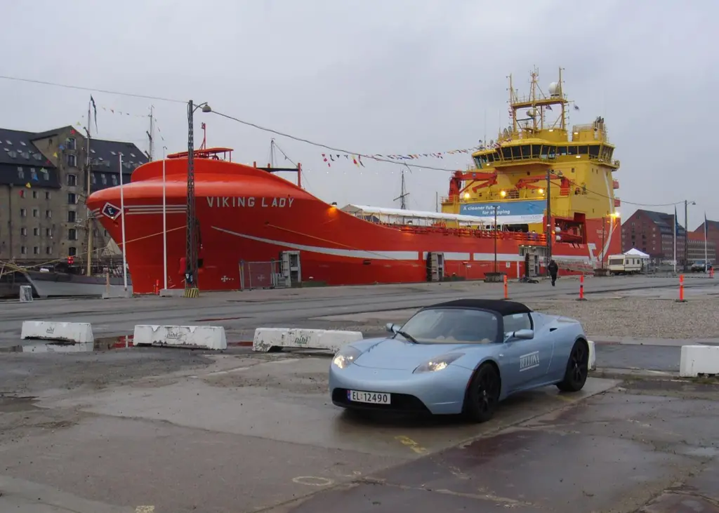 ‘Viking Lady’, soon to be the first full-hybrid ship, alongside in Copenhagen, accompanied by a battery-powered car