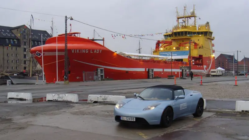 ‘Viking Lady’, soon to be the first full-hybrid ship, alongside in Copenhagen, accompanied by a battery-powered car