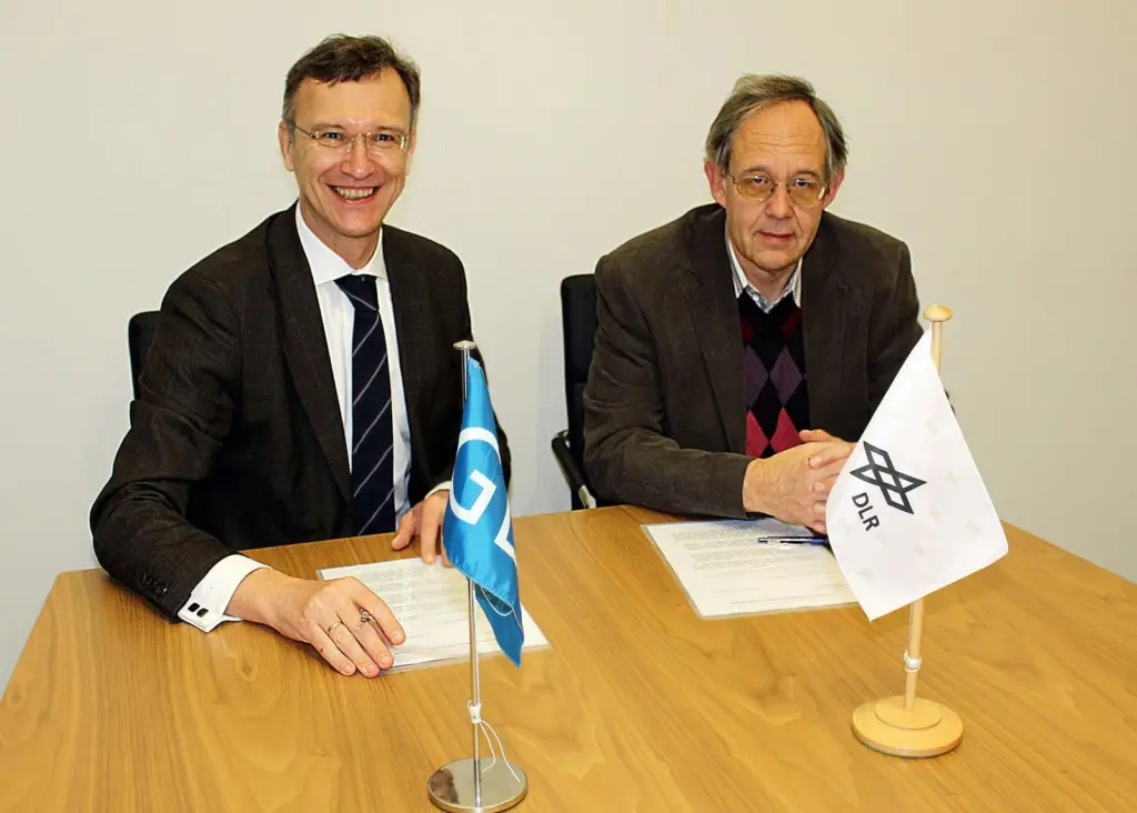 Dr Pierre C  Sames and Dr Dietmar Heyland sign the latest agreement.
