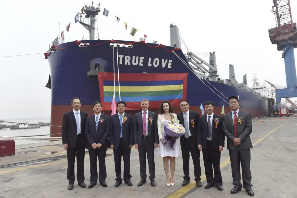Dignitaries attend the naming ceremony of 'True Love', the first carrier of the Green Dolphin design