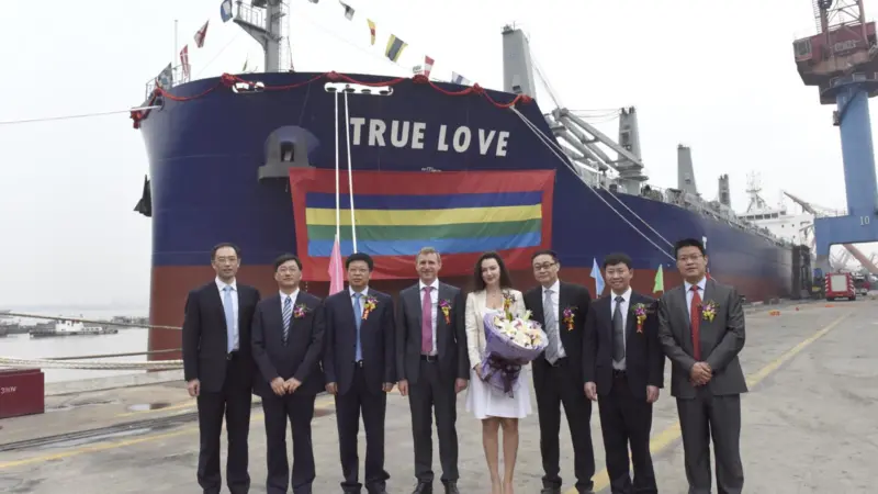 Dignitaries attend the naming ceremony of 'True Love', the first carrier of the Green Dolphin design