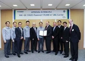 Shin Hyun-soo, CTO of HHI (centre) and Jeremy Barns, commercial marketing director of GE Aviation & Marine hold the apporval inprinciple certificate from Lloyd's Register