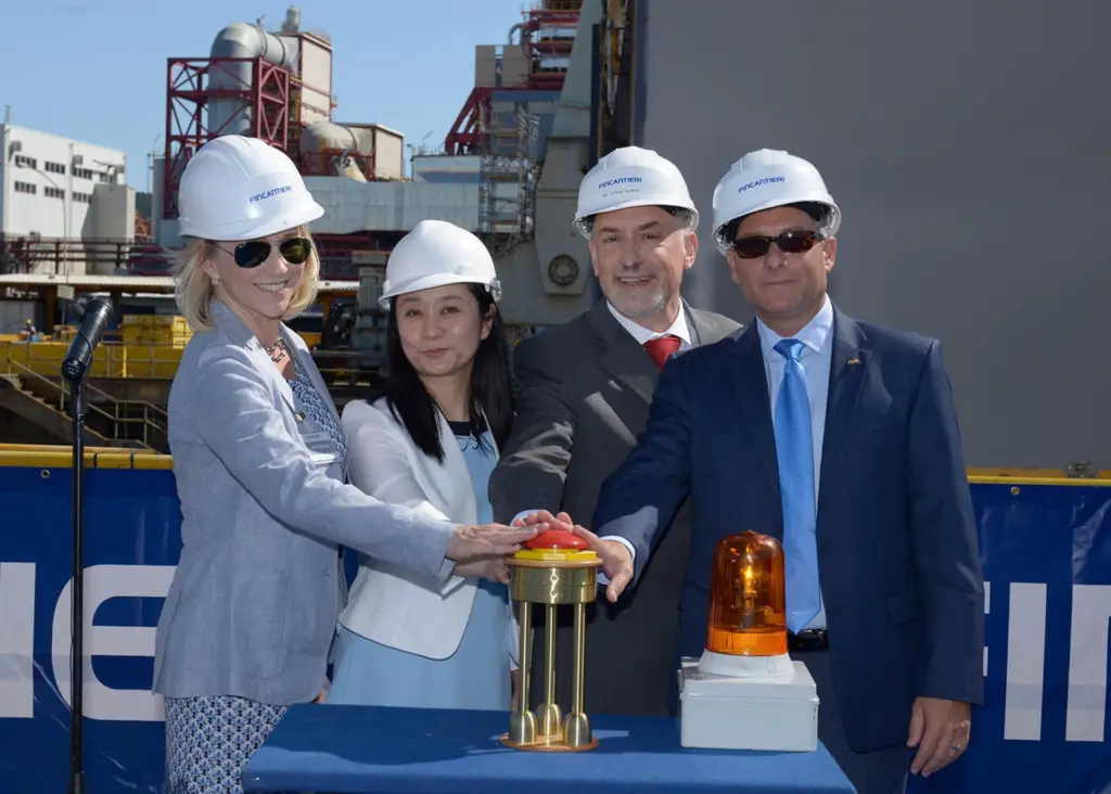 The keel laying ceremony was officiated by (l-r) Julie Benson, ex vice president of public relations for Princess Cruises; Cherry Wang, country director. Carnival China for Princess Cruises; Attilio Dapelo, director of the Fincanteri Monfalcone ...