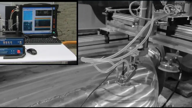 The automated ultrasonic system consists of a small lightweight measurement system which is used in conjunction with a mobile scanning device