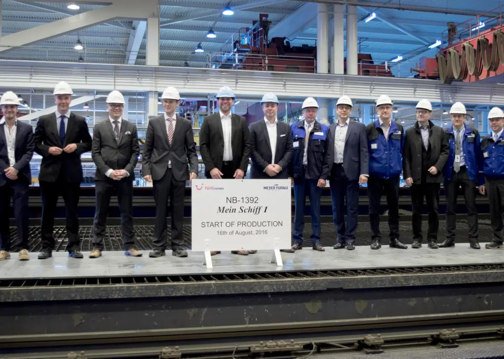 Delegates from Meyer Turku and TUI Cruises attend the steel cutting ceremony for the new 'Mein Schiff 1'