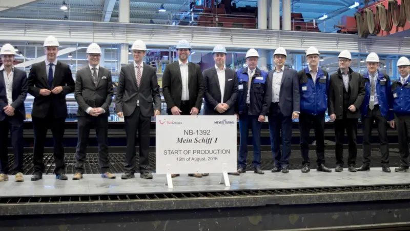 Delegates from Meyer Turku and TUI Cruises attend the steel cutting ceremony for the new 'Mein Schiff 1'