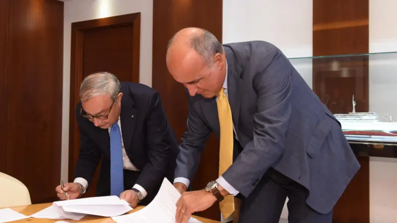 Giuseppe Bono, CEO, Fincantieri and Sandro De Poli, president and CEO, GE Italy agree to develop the Shipboard Pollutant Removal System