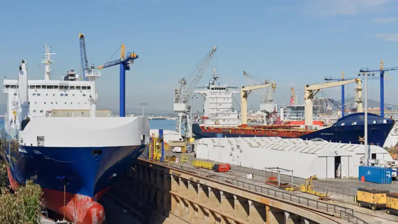 'MN Calao' and container ship 'Ops Hamburg' in dock at Gibdock