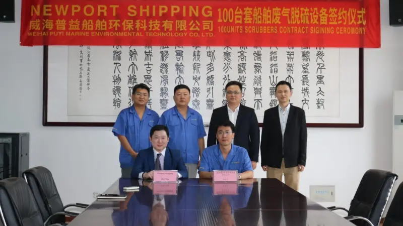 Newport Shipping’s COO Roy Yap (seated left) and Puyier General Manager Ryan Gao sign the supply agreement (credit: Newport Shipping)