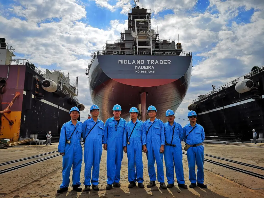 Oldendorff's team in front of the new carrier, 'Midland Trader' Photo: Oldendorff