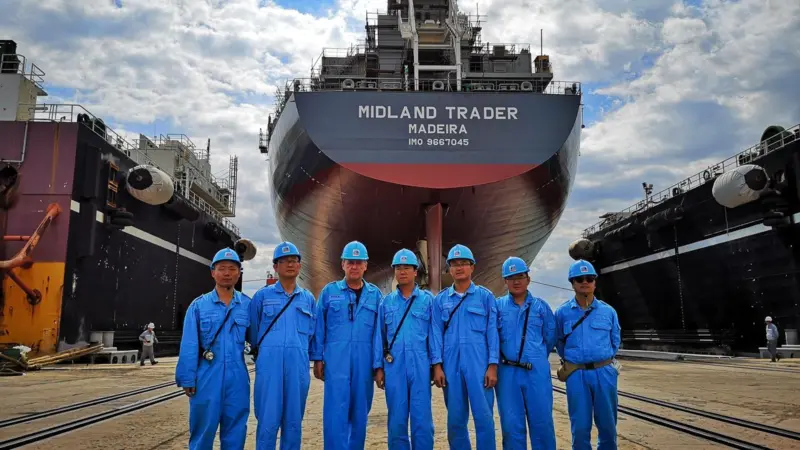 Oldendorff's team in front of the new carrier, 'Midland Trader' Photo: Oldendorff