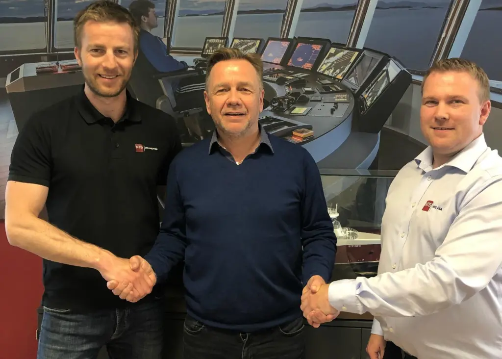 Shaking on it: Dagfinn Eliassen, Market and R&D Manager of NFT, Geir Johan Bakke, CEO of Havyard Group and Oddleif Wigdahl, CEO of NFT. (Credit: Havyard Group).