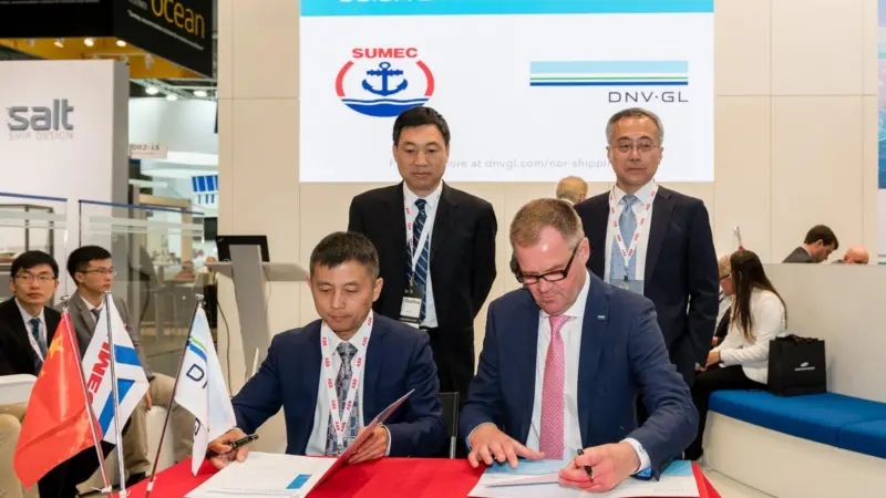 Mr Xu Bin, General Manager of New Dayang Shipbuilding Co., Ltd. (left), and Norbert Kray, DNV GL’s Regional Manager Greater China, signed the JDP at DNV GL's Nor-Shipping stand.