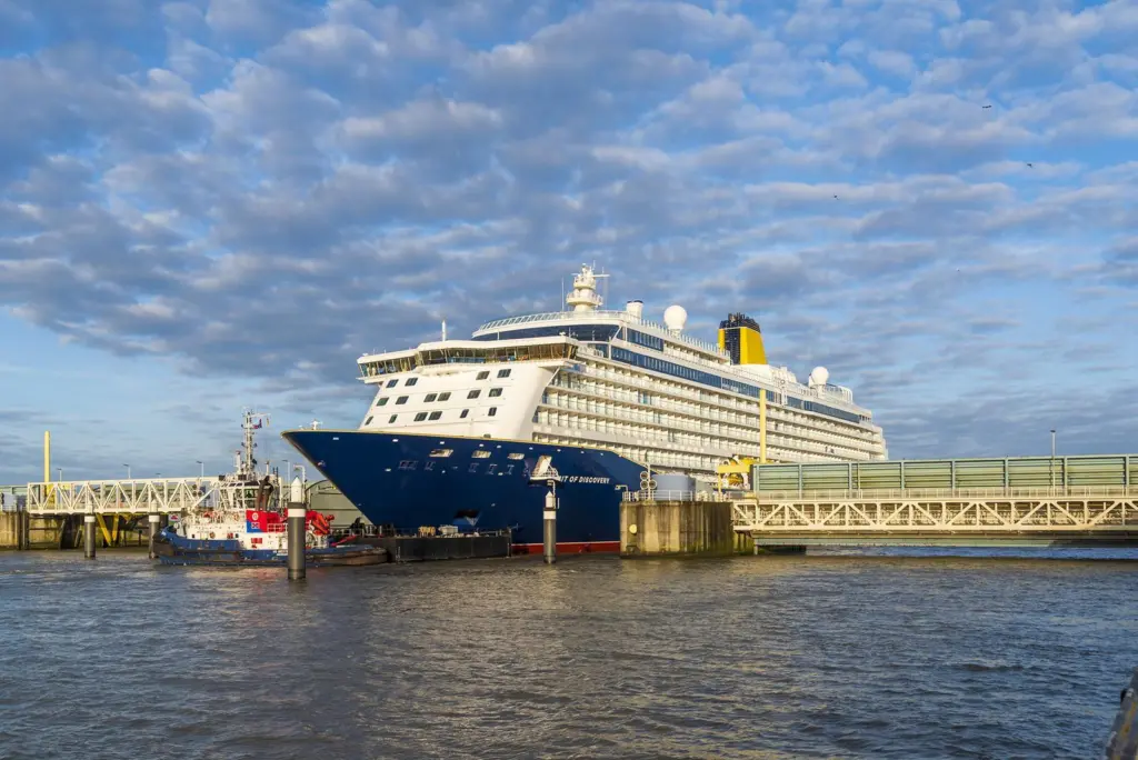 Spirit of Discovery making passage down the River Ems from her Papenburg yard of build (photo courtesy of Meyer Werft).