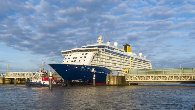 Spirit of Discovery making passage down the River Ems from her Papenburg yard of build (photo courtesy of Meyer Werft).