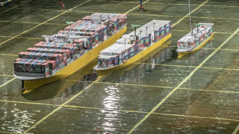 Scale models of a large containership, panamax and feeder in the test basin at MARIN.