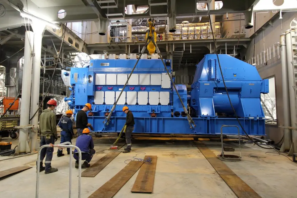 Installation of the third of the six main gensets on the newbuild at the Ulstein yard. (Credit: Ulstein Verft).