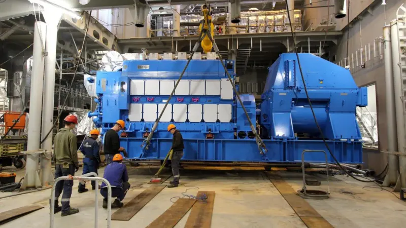 Installation of the third of the six main gensets on the newbuild at the Ulstein yard. (Credit: Ulstein Verft).
