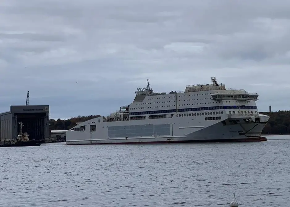 Unfinished Honfleur leaves FSG under tow for completion in Norway (Photo FSG)
