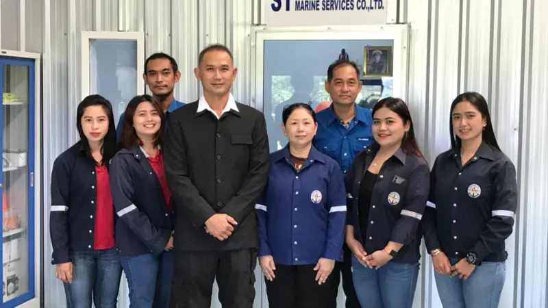 Worrakarn Wiranant (third right) and Pimpisa Thamsangsri (fourth right), S.T. Marine general manager, with other colleagues from S.T. Marine Photo: S.T. Marine