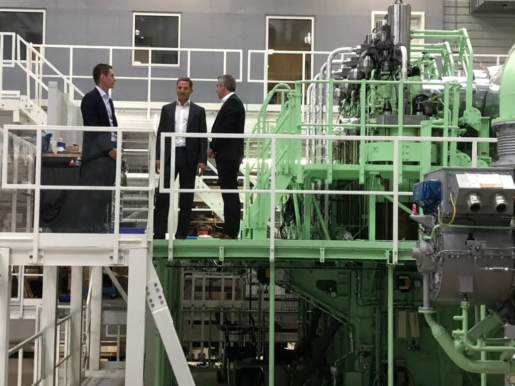 Trafigura's Rasmus Bach Nielsen, Global Head of Shipping Decarbonisation, and Jose Maria Larocca, Co-head of Oil Trading, visiting MAN Energy Solutions' test engine in Copenhagen with Brian Østergaard Sørensen, Vice President, Head of R&D Two-Stroke, earl