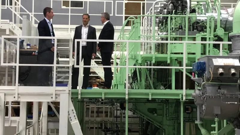 Trafigura's Rasmus Bach Nielsen, Global Head of Shipping Decarbonisation, and Jose Maria Larocca, Co-head of Oil Trading, visiting MAN Energy Solutions' test engine in Copenhagen with Brian Østergaard Sørensen, Vice President, Head of R&D Two-Stroke, earl