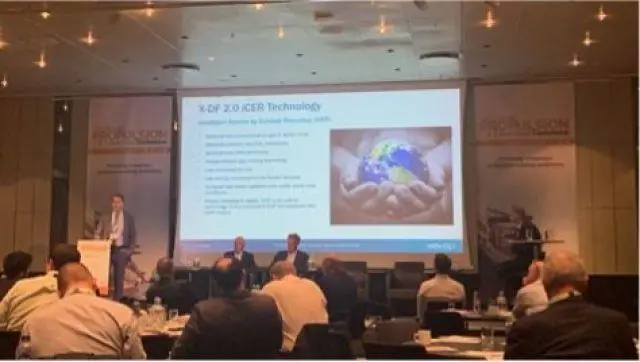 Dominik Schneiter of WinGD sharing details of important decreases in methane slip emissions during a presentation about WinGD's iCER exhaust recycling system