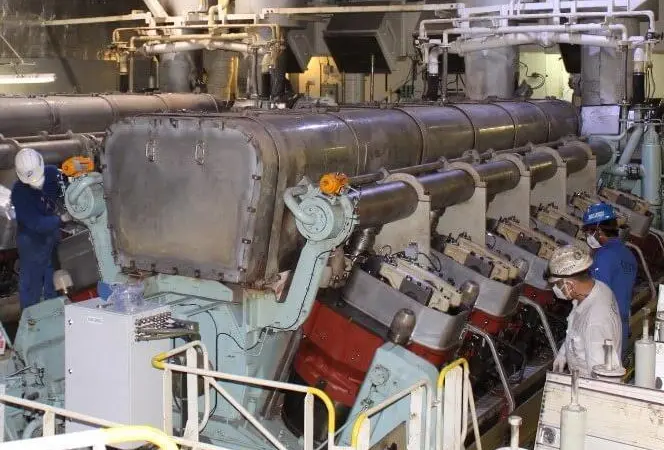 Goltens technicians disassembling a Wartsila 12V50DF