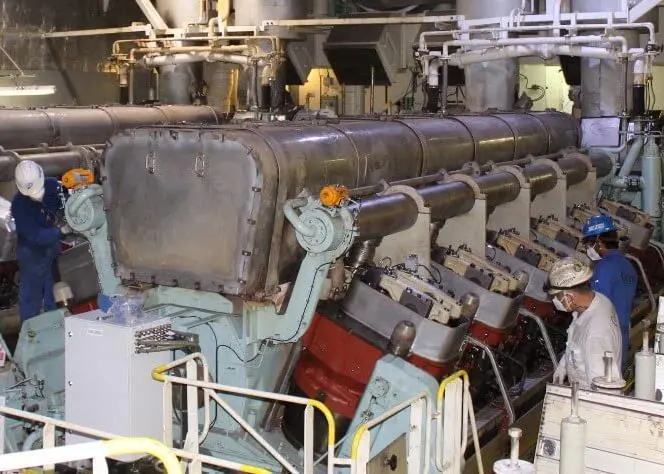 Goltens technicians disassembling a Wartsila 12V50DF