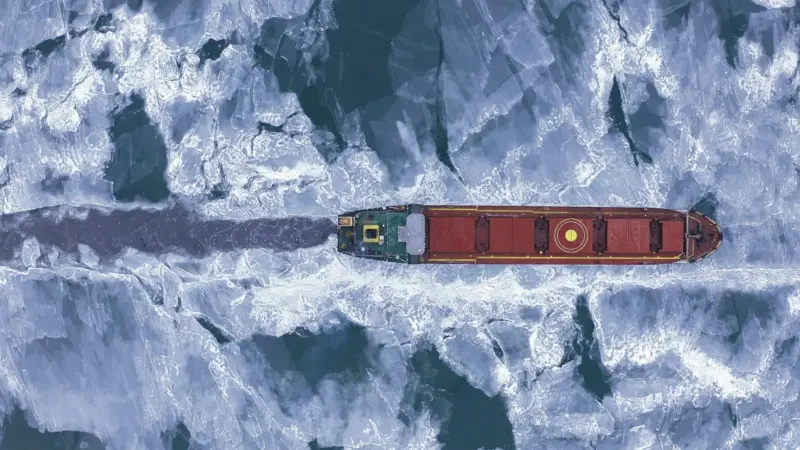 Cargo ship in the sea at winter time