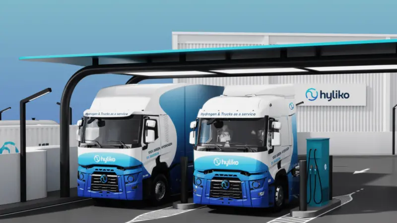 The image shows Hyliko hydrogen trucks ay the green hydrogen refuelling station