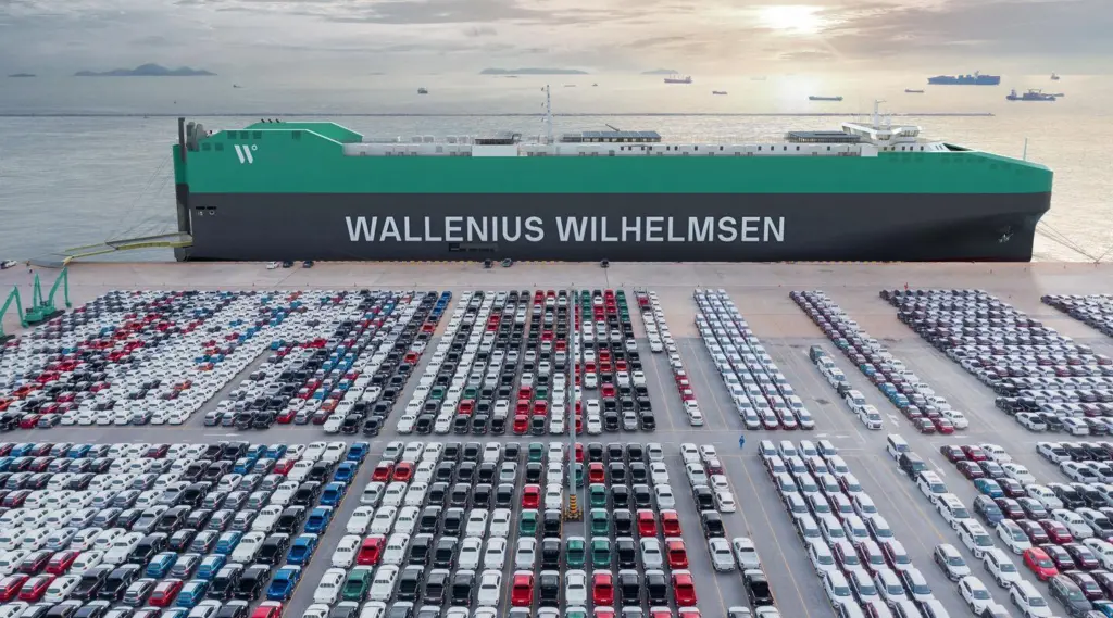 Wallenius Wilhelmsen PCTC at port with rows of cargo