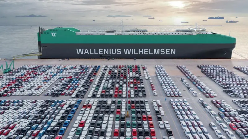 Wallenius Wilhelmsen PCTC at port with rows of cargo
