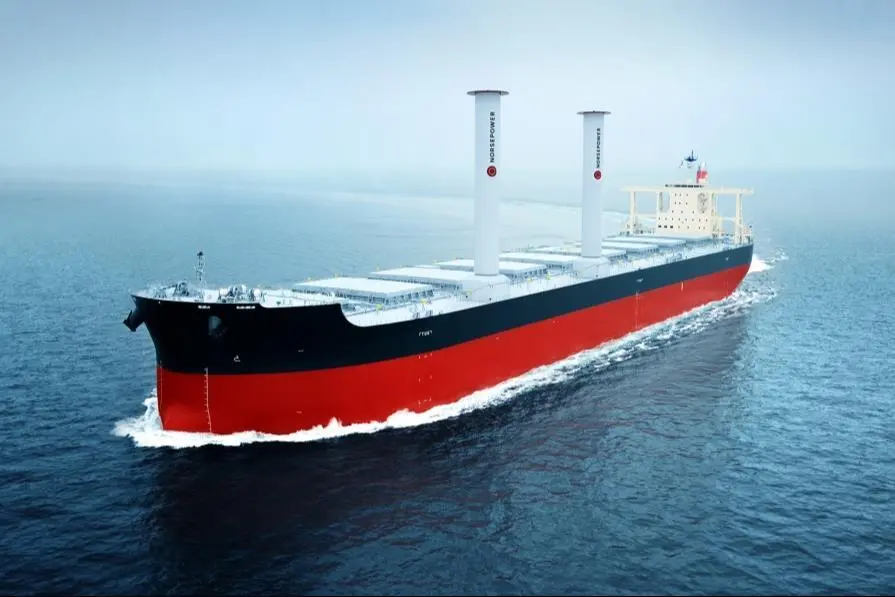 The image shows the vessel Camellia Dream at sea equipped with Norsepower rotor sails