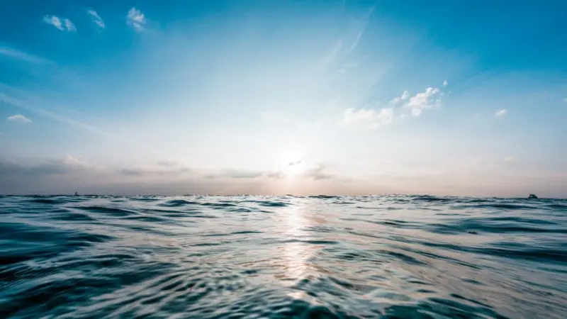 seascape with blue sky and sun