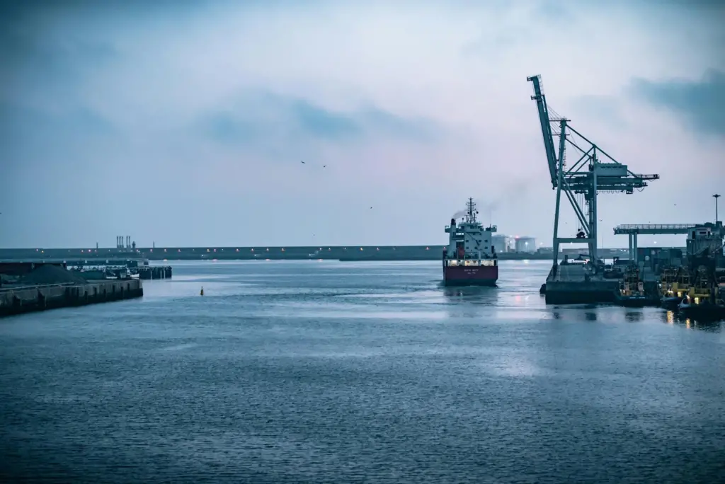 Ship coming into port with crane on the right
