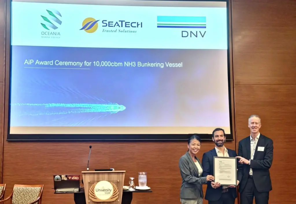 Elisa Woodward, non-executive director of SeaTech Solutions (Australia) and Nick Bentley, managing director of Oceania Marine Energy, being presented with the AiP by Jonathan Abrahams, head of maritime advisory (ANZ & India) DNV at the Ammonia Energy APAC