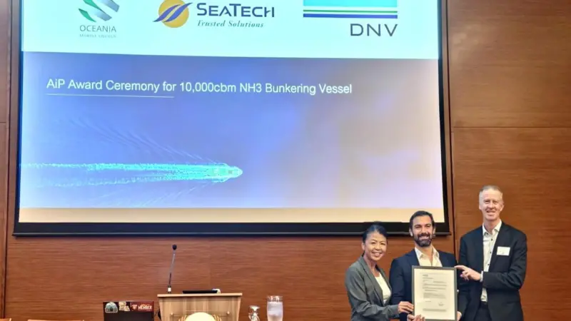 Elisa Woodward, non-executive director of SeaTech Solutions (Australia) and Nick Bentley, managing director of Oceania Marine Energy, being presented with the AiP by Jonathan Abrahams, head of maritime advisory (ANZ & India) DNV at the Ammonia Energy APAC
