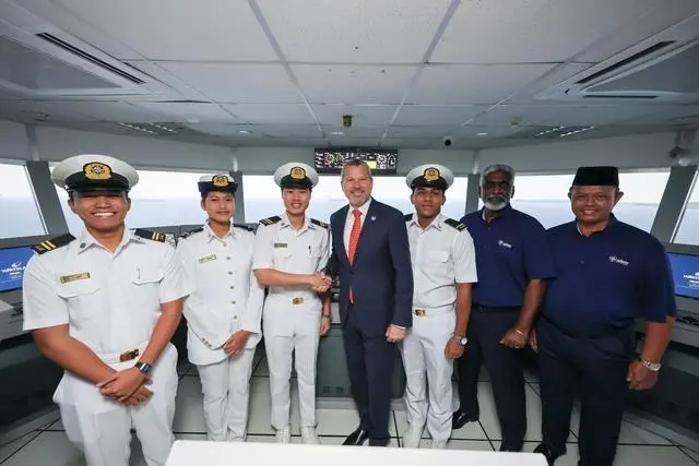 The image shows the inauguration of the Wärtsilä simulation suite at ALAM
