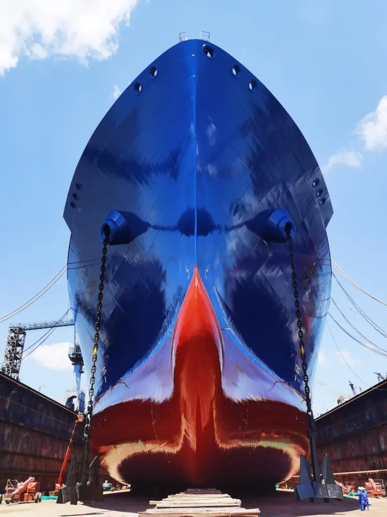 AkzoNobel's Intersleek hull coating. Underside view of a ship in a dry dock after application of new hull coating.