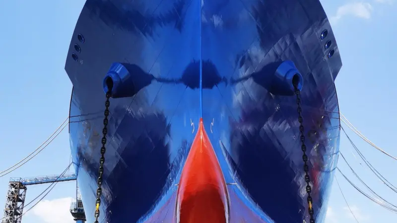 AkzoNobel's Intersleek hull coating. Underside view of a ship in a dry dock after application of new hull coating.